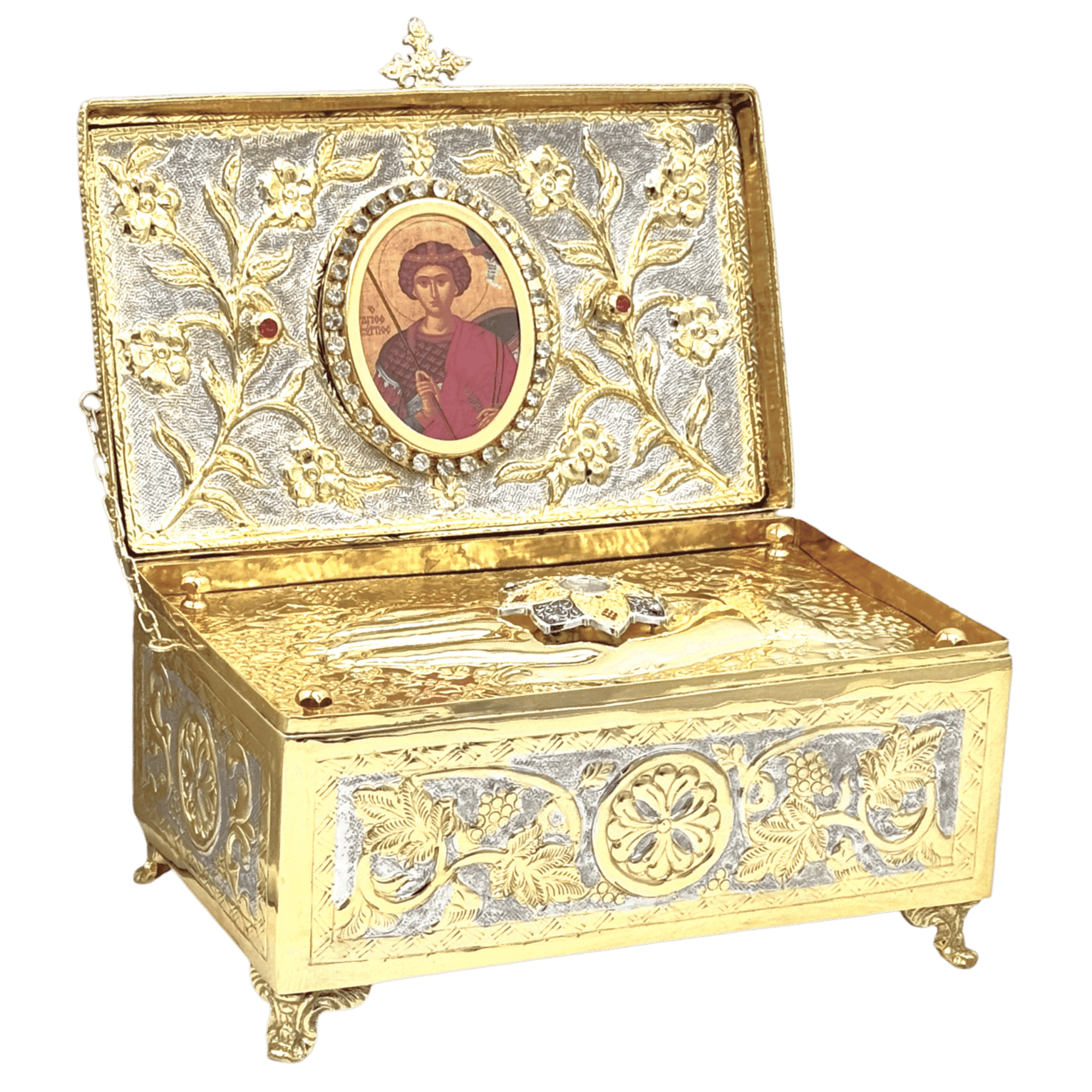 Ornate religious relic box with gold and silver details, featuring an icon of a saint and decorative floral motifs, used for church ceremonial items.