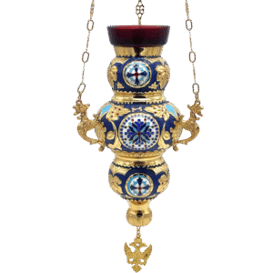 Ornate religious lamp with gold and blue accents, featuring detailed dragon motifs and religious symbols, used in Greek Orthodox church ceremonies.