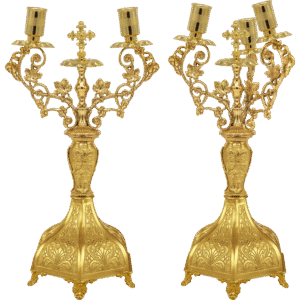 Ornate gold ecclesiastical candelabras for church services and religious ceremonies.