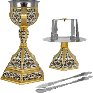 Ornate liturgical chalice and censer set with intricate religious designs, used in Orthodox Christian church ceremonies.