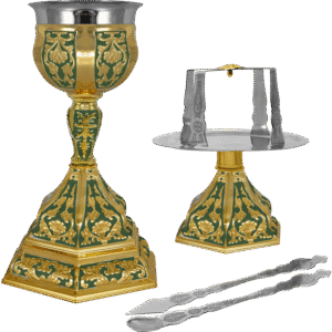 Ornate gold and green ecclesiastical chalice and candle holder set, traditional church accessories for religious ceremonies, crafted with intricate designs.