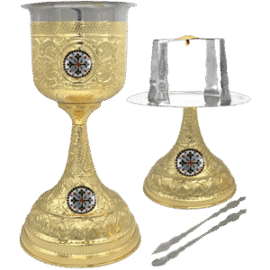 Gold chalice and liturgical tray with ornate designs, religious symbols, and matching tongs for church rituals and sacraments.
