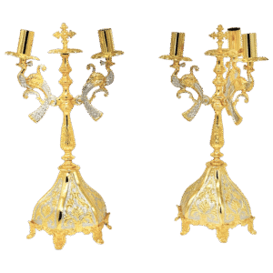 Intricate gold ecclesiastical candle holders with ornate detailing, perfect for church services, religious ceremonies, and religious gift items, reflecting traditional craftsmanship and faith.