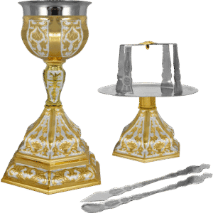 Ornate gilded church chalice and liturgical accessories for Orthodox Christian sacramental rituals.