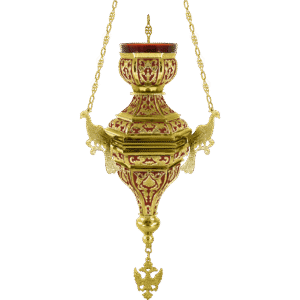 Ornate gold and red church lamp with intricate detailing, used in religious ceremonies and church decor.