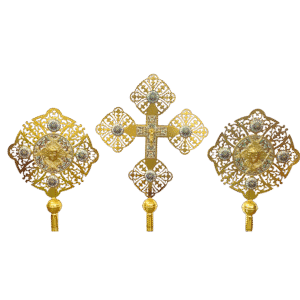 Ornate ecclesiastical liturgical items made of gold with intricate filigree designs, including a central cross and two round plaques with religious icons, used in Greek Orthodox church ceremonies.