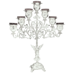 Intricate silver candelabrum with multiple candle holders, ornate design, and religious angel figurine, used for church ceremonies and religious services, showcasing high-quality ecclesiastical silverware.