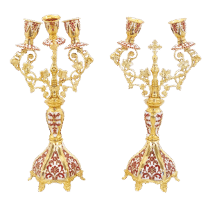 Exquisite gold-plated ecclesiastical candle holders with ornate designs, ideal for church ceremonies and religious decorations.