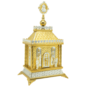 Intricate gold and silver ecclesiastical icon shrine with religious figures and decorative details, used for churches and religious rituals.