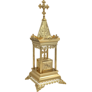 Intricately designed gold ecclesiastical reliquary with religious symbols, used for storing holy relics in Orthodox Christian traditions.