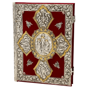 Ornate silver and gold religious iconography book with intricate filigree decoration, red velvet background, and detailed Christian motifs, ideal for ecclesiastical use and church decor.