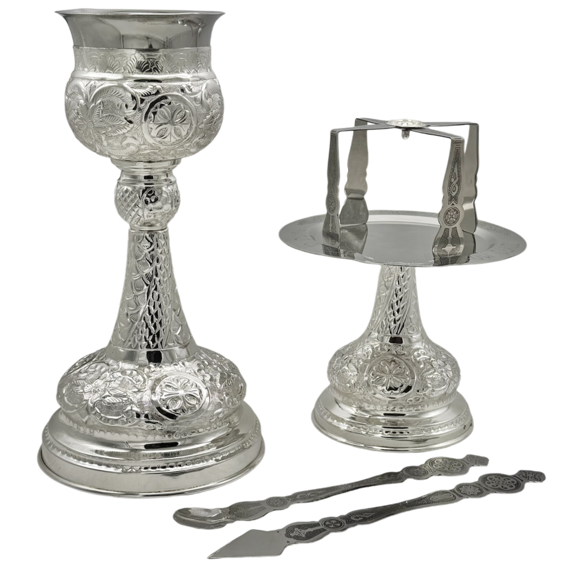 Elegant silver liturgical vessels and accessories for church services.