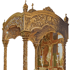 Elegant church altar canopy with intricate wood carvings and religious icons.